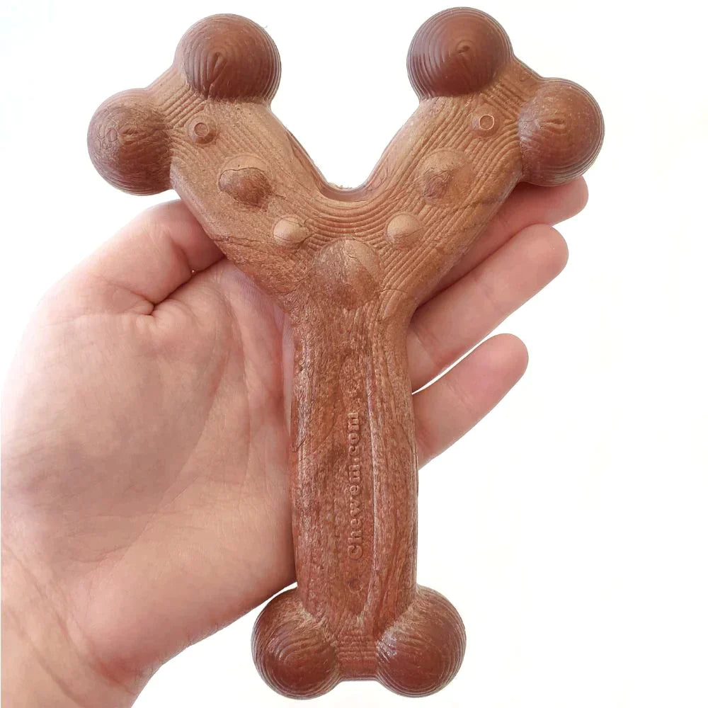 Chew'ems dog chew toy in person's hand